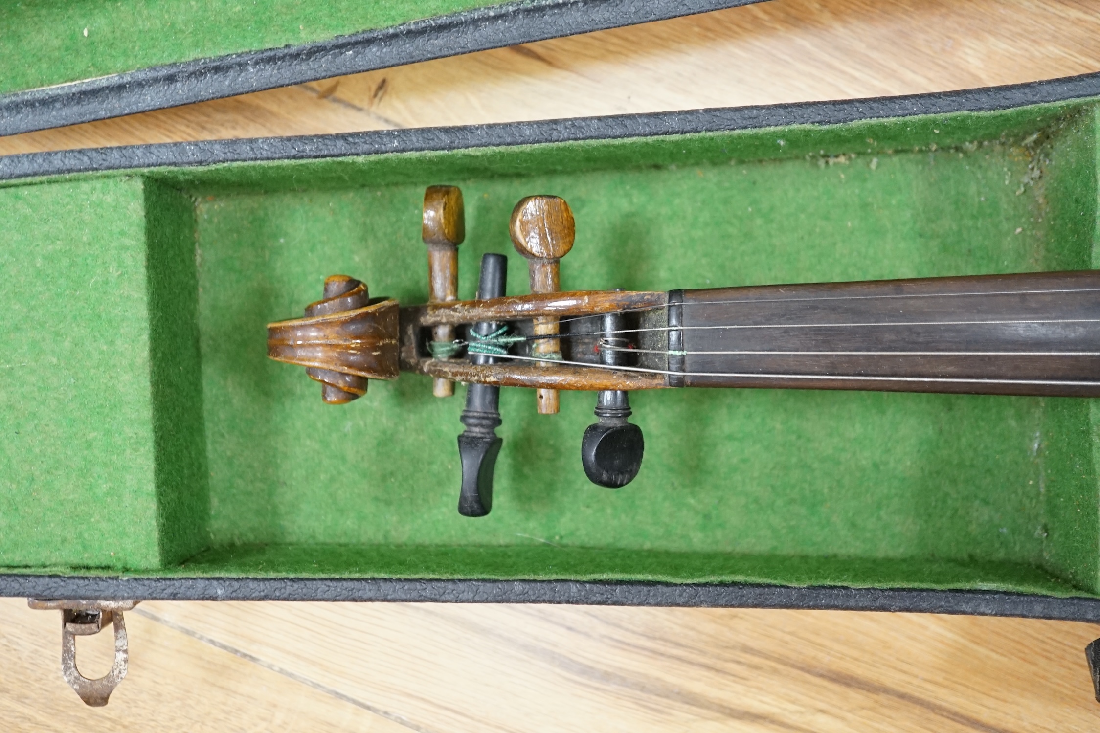 A cased late 19th century violin, back measures 36cm